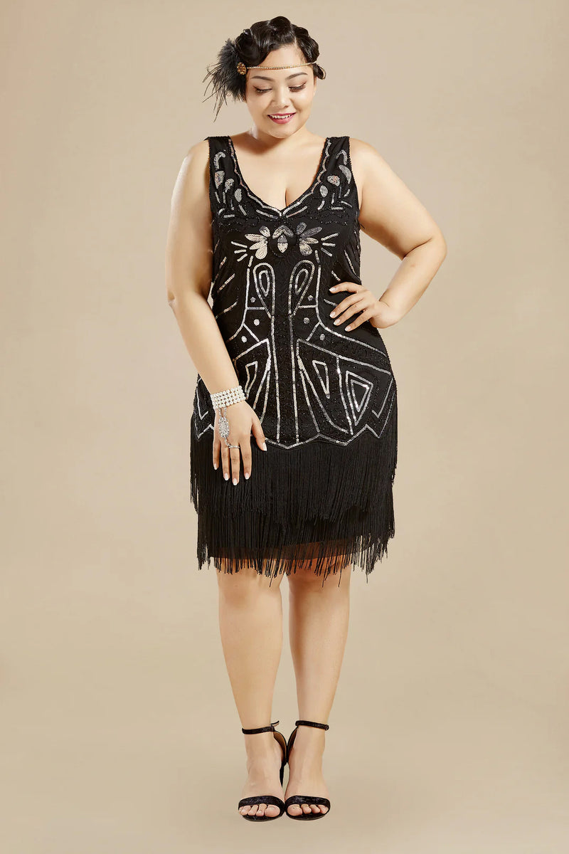 a woman wearing a black flapper costume, a black sleeveless beaded V-neck mini dress