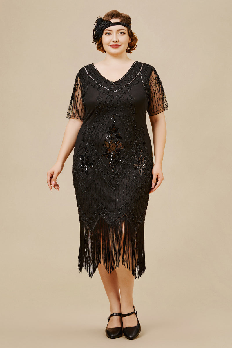 a woman wearing a black Paisley Flapper Plus-size Dress with fringed, uneven hemline