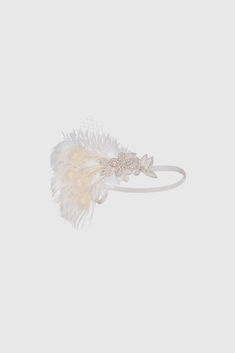 a fluffy white headband adorned with beads and feathers