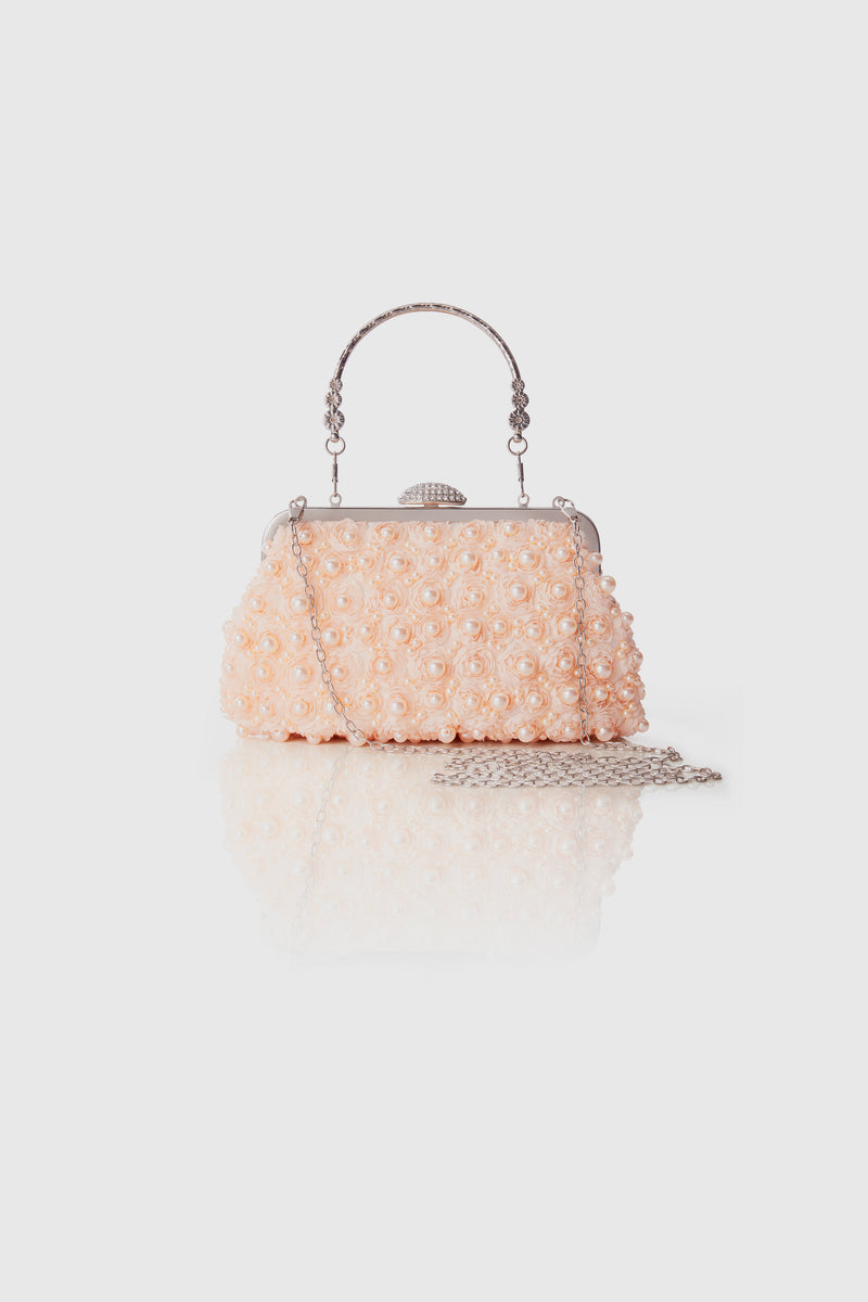 1920s Luxury pink pearl-studded clutch with a metal handle and chain