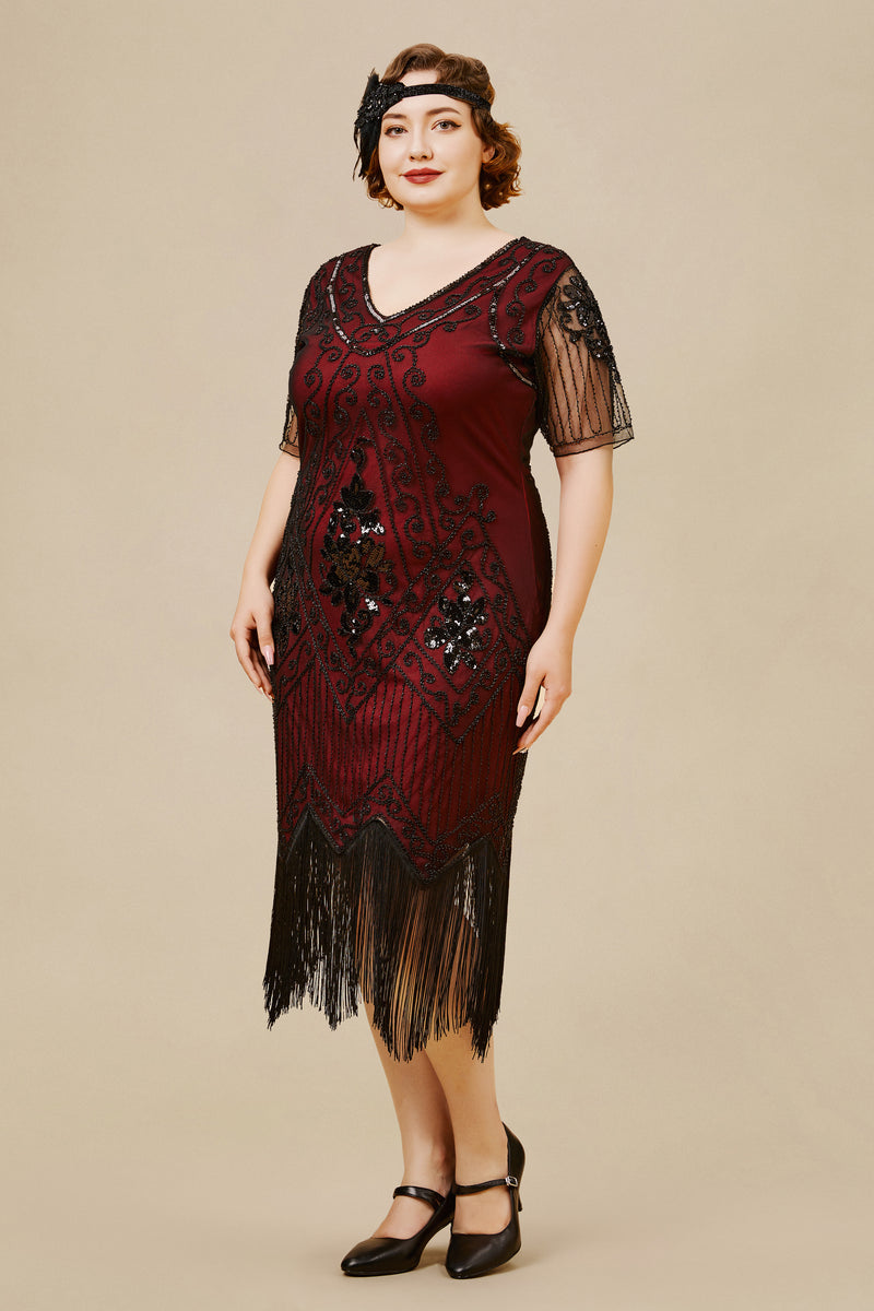 a woman wearing a wine-red plus size art deco dress with irregular Fringed hem, Beaded and Sequined bodice, v-neck, and see-through sleeves
