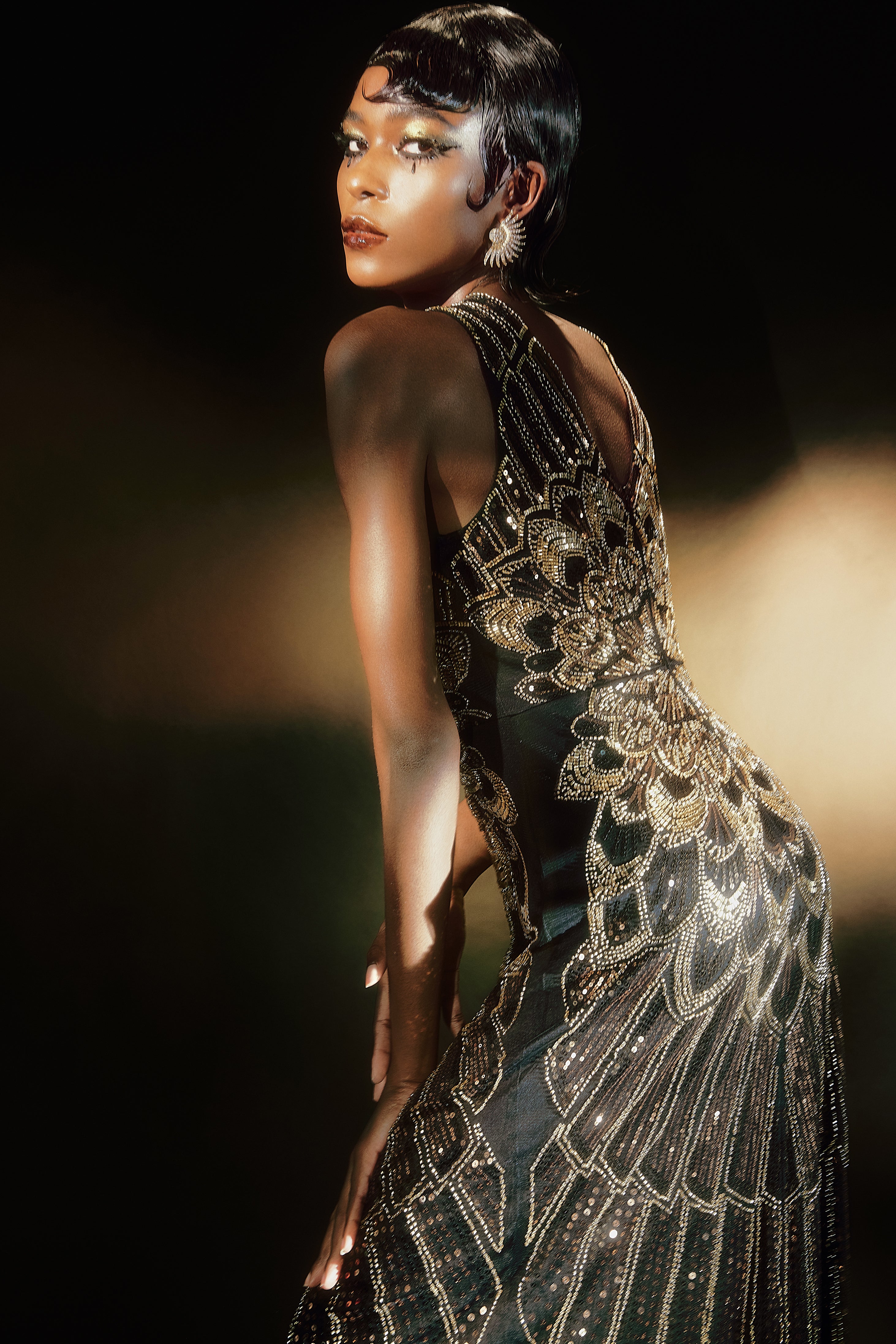 1920's black and gold dress Black Gold Fringe Hem Dress