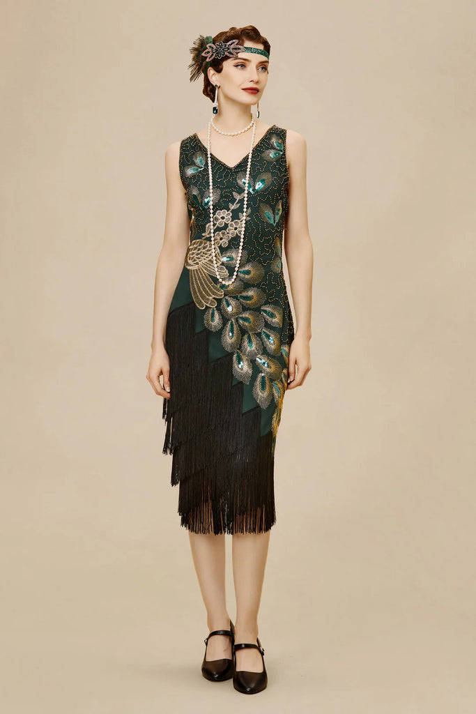 A woman wearing a flapper dress with a peacock design on the bodice and an irregular tasseled hemline