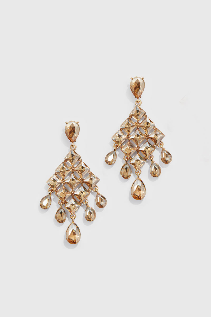 a pair of elegant gold drop earrings in geometric shape