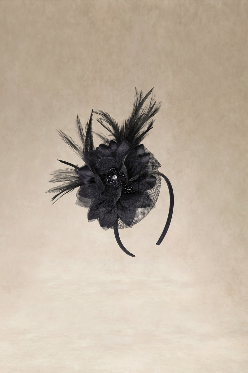 a fascinator headband in black motif - with black feather and black floral lace 